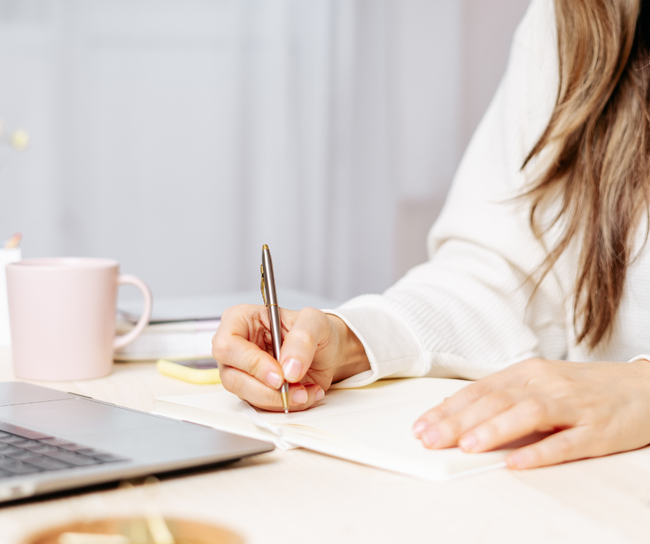 Girl writing on a computer