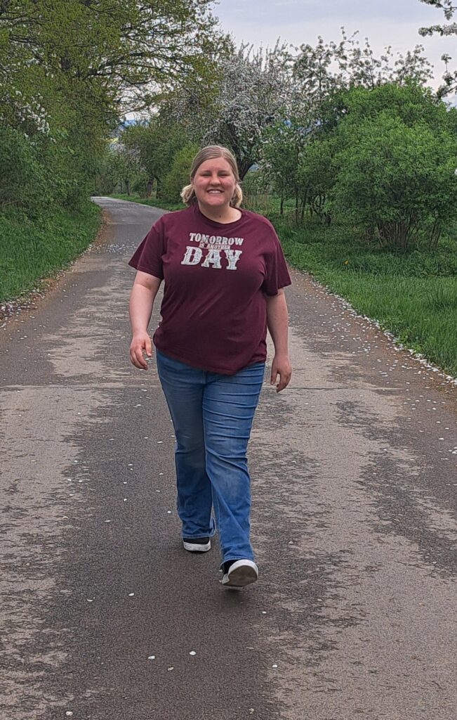Mack walking by orchards