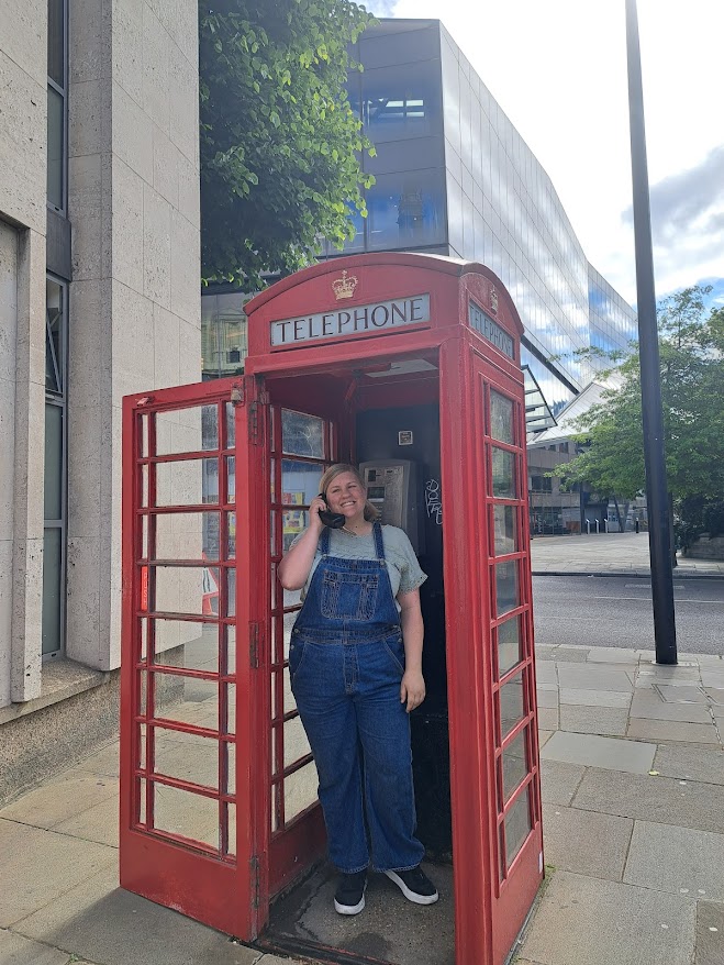 Mack at a telephone booth in London